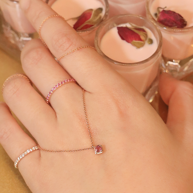 Pink sapphire half eternity ring